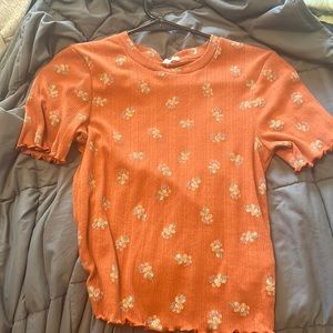 burnt orange high neck tee.